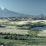 Small hills NNE of Mt. Shasta are hummockslide 380,000 and 300,000 years ago. This view is from the top of Gregory Mountain, located about 40 km from the summit of the volcano. The prominent cone on the right skyline is Black Butte, a collection of four overlapping lava domes that were erupted about 9,500 years ago.