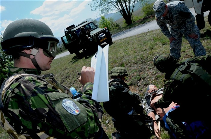 A Romanian Special Forces medic, left, and a U.S. Army physician assigned to 1st Battalion, 10th Special Forces Group evaluates a multinational team of SOF medics as they render first aid to a simulated casualty to safety as part of the Tactical Combat Casualty Care (TCCC) course held in Udbina, Croatia. 
U.S. Special Operations Command Europe (SOCEUR) developed and conducted the TCCC Train-the-Trainer course to enhance the SOF capability and interoperability of SOF medics from eight NATO and partner nations, but most importantly, to incorporate one recognized standard for managing trauma on the battlefield. (U.S. Army photo by Master Sgt. Donald Sparks, SOCEUR Public Affairs Officer     Ã?Â?Ã?Â¢Ã photo approved for public release by Master Sgt. Donald Sparks, SOCEUR PAO).
