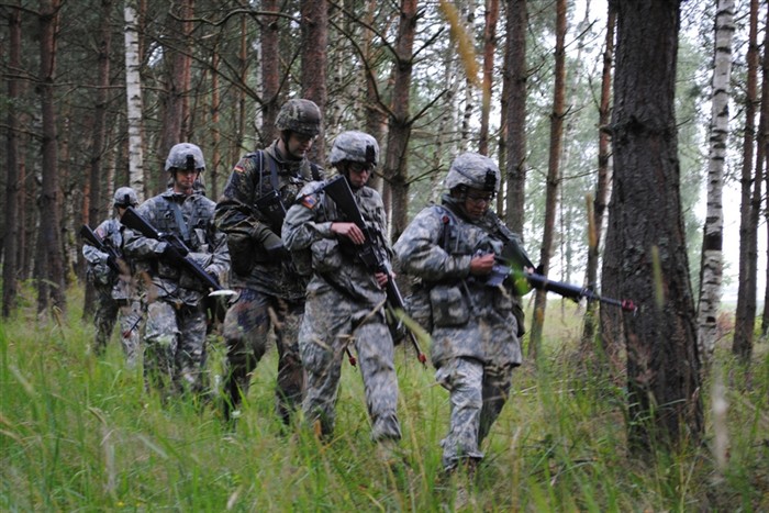 Candidates in the 2011 U.S. Army Europe Expert Field Medical Badge Standardization and Testing familiarize themselves with their terrain pace count before testing their land navigation skills July 31, 2011 at the Grafenwoehr Training Area, Germany. U.S. and multinational candidates are in Grafenwoehr for two weeks to earn the right to wear one of the most coveted badges in the military medical community. (Photo by Staff Sgt. Thomas Wheeler, 138th PAD, NYARNG)