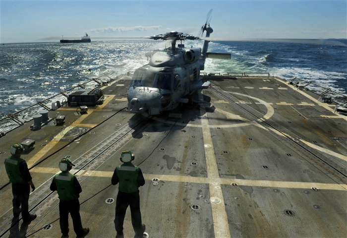 BALTIC SEA - Sailors from Helicopter Anti-Submarine Light Squadron (HSL) 48, Det. 7, observe the rotor on an SH-60B Seahawk during a maintenance check aboard the guided-missile destroyer USS Farragut (DDG 99). Farragut is on a scheduled deployment in support of maritime security operations and theater security cooperation efforts in the U.S. 6th Fleet area of responsibility. 