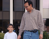 photo: father and son holding hands