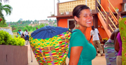 Kelly Granger in Ghana with her djembe, a traditional Ghanian drum made from carved wood and goatskin.