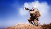 A Marine watches as the rocket from his light anti-tank weapon closes in on a compound used by enemy fighters during a firefight in Trek Nawa, Afghanistan.