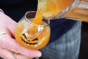 pumpkin beer in a jack-o-lantern glass