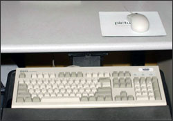 Figure 1. Mouse placement that is too far away because of a small keyboard tray