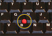 Figure 8. Fingertip joystick for a notebook computer