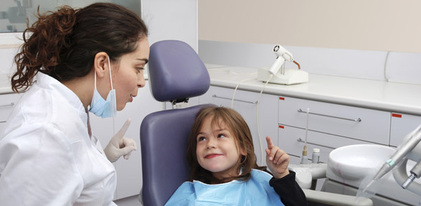 Women Dentist with Child Patient