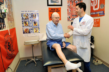 Dr. Marc Pietropaoli, president and CEO of Victory Sports Medicine and Orthopedics in Skaneateles, is shown with patient Gene Riley, of Owasco, Monday. Victory Campus is a proposed 99.5-acres health and wellness, and sports complex on Route 20 in the Town of Skaneateles. Michelle Gabel/The Post-Standard