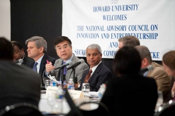 NACIE participants around table with Locke