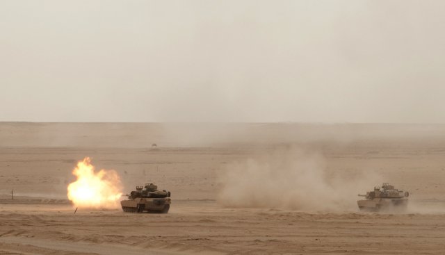 M1A2 Abrams Tanks of the 2nd Combined Arms Battalion, 8th Cavalry engage targets during a Combined-Arms Live-Fire Exercise with the Kuwaiti Army's 151st Tank Battalion, 15th Mubarak Armored Brigade, at northern Kuwait's Udari Range, May 8, 2012. The 2nd Combined Arms Battalion belongs to the 1st Brigade Combat Team, 1st Cavalry Division (Iron Horse). The exercise also involved the brigade's 1st Battalion, 82nd Field Artillery, the brigade headquarters, and the 29th Combat Aviation Brigade.