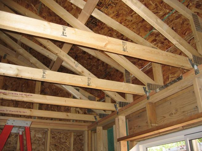 Planning carefully for insulation results in reduced utility bills and superior comfort during the life of the home. In this house, raised heel trusses accommodate R-60 insulation. | Credit: Paul Norton, NREL.
