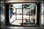 NREL's Large-Volume Battery Calorimeter has the highest-capacity chamber in the world for testing of this kind. From bottom clockwise:NREL researchers Matthew Keyser, Dirk Long & John Ireland | Photo Courtesy of Dennis Schroeder