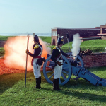 The morning gun is fired at Fort McHenry.