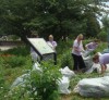 Volunteers from Milwaukee business Grant-Thorton do a clean-up in the Juneau Park Garden.