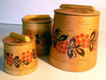 Three birch bark boxes.