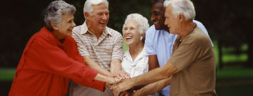 Photo: Group of seniors putting hands together