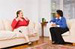 Photo of two women sitting and talking