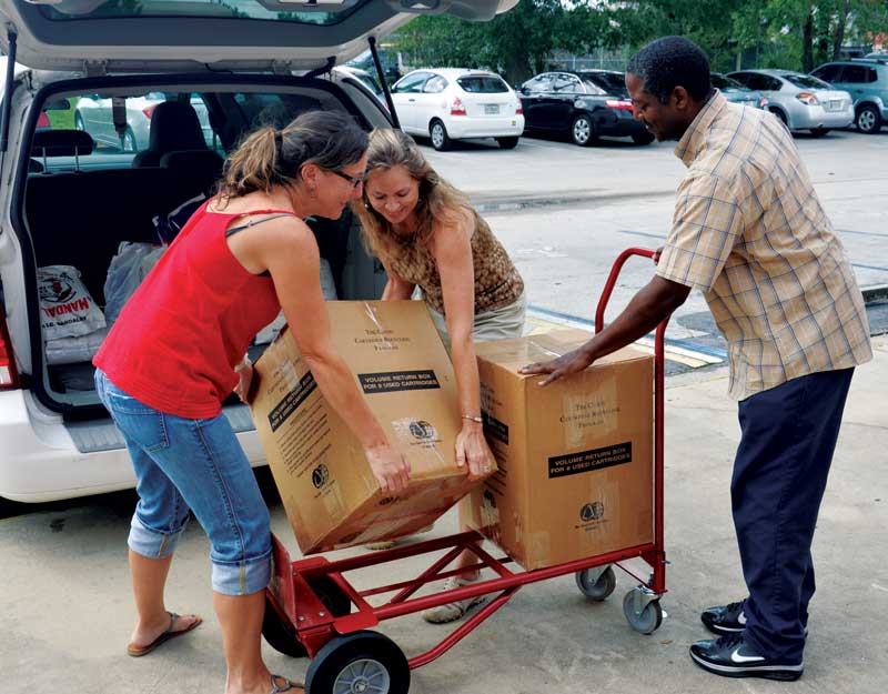 Service staff unload some of the 1,136 pounds of food donated to locate food banks - USFWS Photo