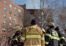 Photo of NIST researchers outside of burning building.