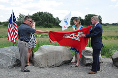 Lifting USACE flag to unveil a plaque