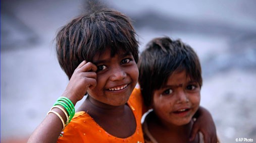 Two Indian girls play on a street on International Day of the Girl Child in Hyderabad, India, October 11, 2012. [AP Photo]