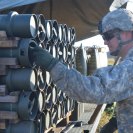 Photo: SSG Ken Visor, Alpha Battery, 113th FA unlocks several M3A1 propellants for firing the M107 High Explosive Rounds from the M109 Paladin during a live fire exercise by Army National Guard and Active Duty Field Artillery students attending the 13 Bravo Advanced Leadership Course at the N.C. Military Academy, located at Fort Bragg. (N.C. National Guard photo by Tech. Sgt. Brian E. Christiansen)