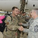 Photo: 188th Fighter Wing Command Chief Master Sgt. Asa Carter, right, greets Technical Sgt. Eric Jones. Approximately 280 Airmen with the 188th Fighter Wing returned from a deployment to Bagram Airfield, Afghanistan Oct. 12. (National Guard photo by Senior Master Sgt. Dennis Brambl/188th Fighter Wing Public Affairs)