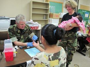 Photo: In this picture, two Commissioned Corps officers conduct diabetes glucose level screenings during ‘Operation Fortitude.’ LCDR Mitchel Holliday, a Nutrition Specialist with the Federal Bureau of Prisons stated that “without question, the CHASM initiative was able to make a difference. […]I had the privilege of interviewing community members that had utilized the RAM Clinic services. The testimonials they gave related to the healthcare challenges they face was unbelievable. The sincere appreciation they had for the services they were provided was unquestionable.” Read more here: http://1.usa.gov/OEBADV.