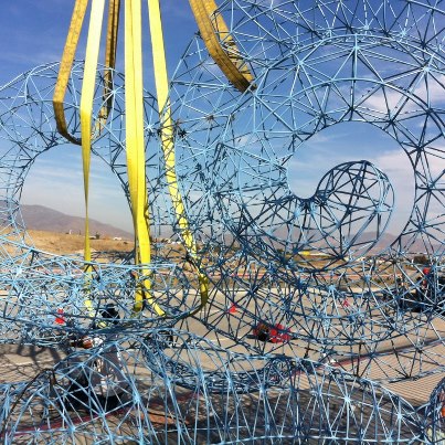 Photo: With all of the peices welded together into a single sculpture, 1000 times the size of the human ear, the piece gets strapped in, ready to be lifted by crane.