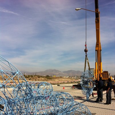 Photo: After a long ride (23 hours on the back of a truck, to be precise) from Pedro's studio in Mexico City, the Ear has to be reassembled outside the Consulate before being transported by crane to its new home.  Enter the Welder.