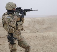 U.S. Army Capt. Devin Ciminero, a Kandahar Provincial Reconstruction Team security force company commander with 1st Platoon, Alpha Company, 1st Battalion, 182nd Infantry Regiment, Rhode Island National Guard, scans his sector while providing security during a site assessment of the Dowry Rud Check Dam in Kandahar province, Afghanistan, on Jan. 21, 2012. DoD photo by Senior Airman Sean Martin, U.S. Air Force. (Released)