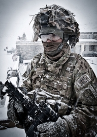 U.S. Army Pfc. Dewey So endures the harsh blast of an Afghan winter storm in the village of Marzak Jan. 15, 2012.