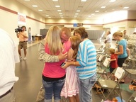 Missouri National Guard Sgt. Randall Stewart hugs his Family following a welcome home ceremony for Detachment 1, Company I, 185th Theater Aviation Company at the old aiport terminal building in Springfield. As a member of the detachment, Stewart served for seven months at the Sinai Peninsula in Egypt.  (Photo by Matthew J. Wilson)