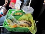 $1 shower caddy for when kids have to eat in the car. Good for car trips. Why don't I come up with these ideas!