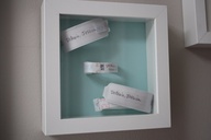 Framed hospital bracelets from mommy, daddy and baby