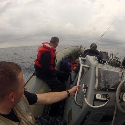 Photo: CARIBBEAN SEA (Oct. 11, 2012) Sailors in a rigid-hull inflatable boat (RHIB) assigned to the guided-missile frigate USS Underwood (FFG 36) conduct training with U.S. Coast Guardsmen assigned to Law Enforcement Detachment (LEDET) 101 as they fly in an SH-60B Sea Hawk helicopter assigned to the Vipers of Helicopter Anti-Submarine Squadron Light (HSL) 48. Underwood is deployed to Central and South America and the Caribbean in support of Operation Martillo and U.S. 4th Fleet’s mission, Southern Seas 2012. (U.S. Navy photo by Mass Communication Specialist 2nd Class Stuart Phillips/Released)