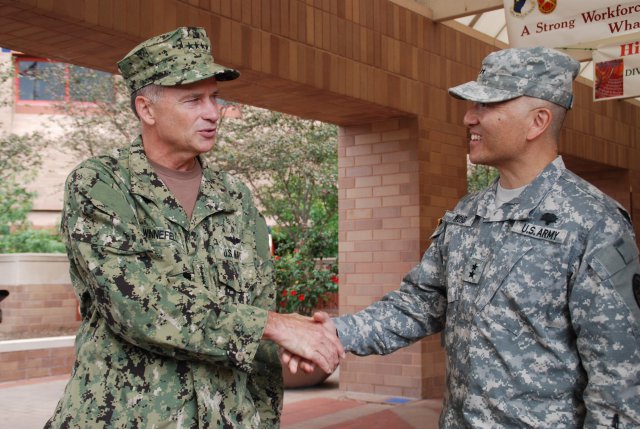 Navy Adm. James A. Winnefeld Jr., vice chairman of the Joint Chiefs of Staff, talks with Maj. Gen. M. Ted Wong, commander of Brooke Army Medical Center, in front of the San Antonio Military Medical Center in San Antonio, Oct. 12, 2012. During his visit, Winnefeld met with wounded warriors in the hospital and Center for the Intrepid, a state-of-the-art rehabilitation center, and also presented two Purple Hearts to Soldiers during an early morning ceremony.