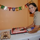 Photo: Lt. j.g. Loreli Owens, a newly commissioned Medical Service Corps Health Care Administrator, celebrates with cake following the ceremony.