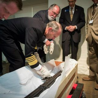 Photo: 121009-N-WL435-395 WASHINGTON (Oct. 9, 2012) Chief of Naval Operations (CNO) Admiral Jonathan Greenert gets a preview from National Museum of the US Navy Director, Jim Bruns, of a historical, multi-chamber gun used by the U.S. Navy during the War of 1812, which helped turn the tide of the war while at a reception at the National Museum of the U.S. Navy to commemorate the Navy's 237th birthday. This year marks the bicentennial of the War of 1812. (U.S. Navy photo by Mass Communication Specialist 1st Class Peter D. Lawlor/Released)