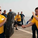 Photo: 120929-N-NU634-044 ARABIAN SEA (Sept. 29, 2012) – Ensign Joseph Balent, from Sherwood, Ark., practices baton strikes during oleoresin capsicum (OC) spray training on the flight deck aboard the guided-missile cruiser USS Hue City (CG 66). Hue City is deployed to the U.S. 5th Fleet area of responsibility conducting maritime security operations, theater security cooperation efforts and support missions as part of Operation Enduring Freedom. (U.S. Navy photo by Mass Communication Specialist Seaman Darien G. Kenney/Released)