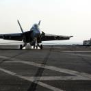 Photo: 121004-N-CH661-223 ARABIAN SEA (Oct. 4, 2012) Rear Adm. Walter E. Carter, Jr., commander, Enterprise Carrier Strike Group, and Capt. Robert D. Boyer, commander, Carrier Air Wing (CVW) 1, make an arrested landing in an F/A-18F Super Hornet assigned to the “Checkmates” of Strike Fighter Squadron (VFA) 211 after participating in an aerial change of command for Combined Task Force (CTF) 50. Enterprise is deployed to the U.S. 5th Fleet area of responsibility conducting maritime security operations, theater security cooperation efforts and support missions for Operation Enduring Freedom. (U.S. Navy photo by Mass Communication Specialist 3rd Class Jared King/Released)