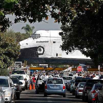 Photo: Breaking: Endeavour has fallen at least three hours behind, delayed by trees, a narrow stretch of roadway and an LAPD truck that blocked the shuttle's path. For more: http://lat.ms/QYhJ7p.

Photo: Don Bartletti / Los Angeles Times