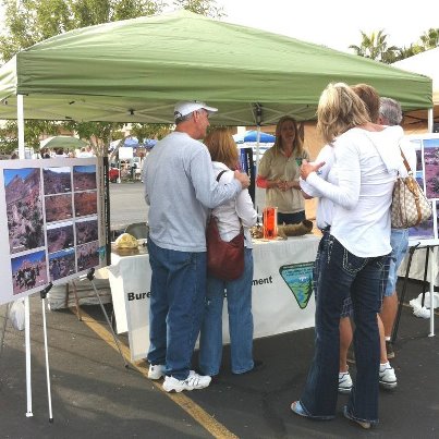 Photo: People gather around the BLM Southern Nevada District booth at the Gold Butte Days Festival held in Mesquite, Nevada. The 350,000 acre Gold Butte region, managed by the BLM, is known for its stunning scenery and cultural resources. The City of Mesquite is a gateway community to this area and plans to make the Gold Butte Days Festival an annual event.