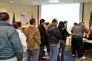 Participants wait in line to register