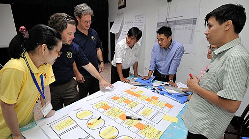 National Oceanic and Atmospheric Administration employees offer a course in fisheries management under the auspices of Pacific Partnership 2012 in Cambodia, July 2012. [State Department photo/ Public Domain]