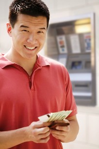 Man withdrawing money from a money machine