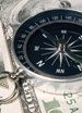 image of compass on dollars