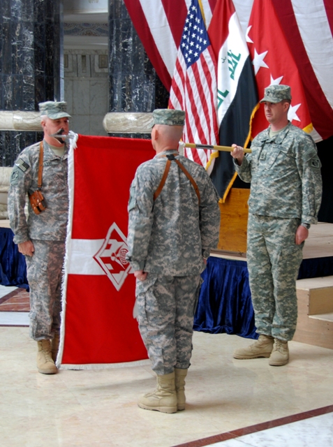 Maj. Gen Michael Eyre (left) and Cmd. Sgt. Maj. Mitch Prater (center) prepare to case the United States Army Corps of Engineers’ Gulf Region Division colors during an inactivation ceremony at Al Faw Palace, Baghdad, Iraq.