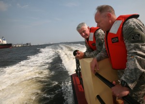 LTG Van and COL Anderson look over the rail of a boat during a tour of the Chesapeake Bay.