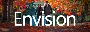 Students walk on campus in fall | text: Envision Idaho